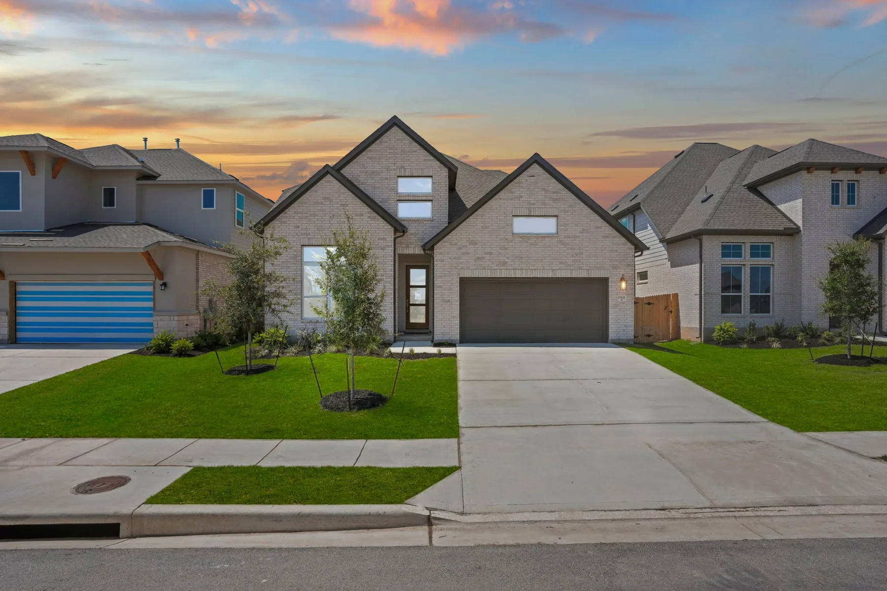 A Coventry home on Judys View in The Grove at Blackhawk, Pflugerville, at sunset